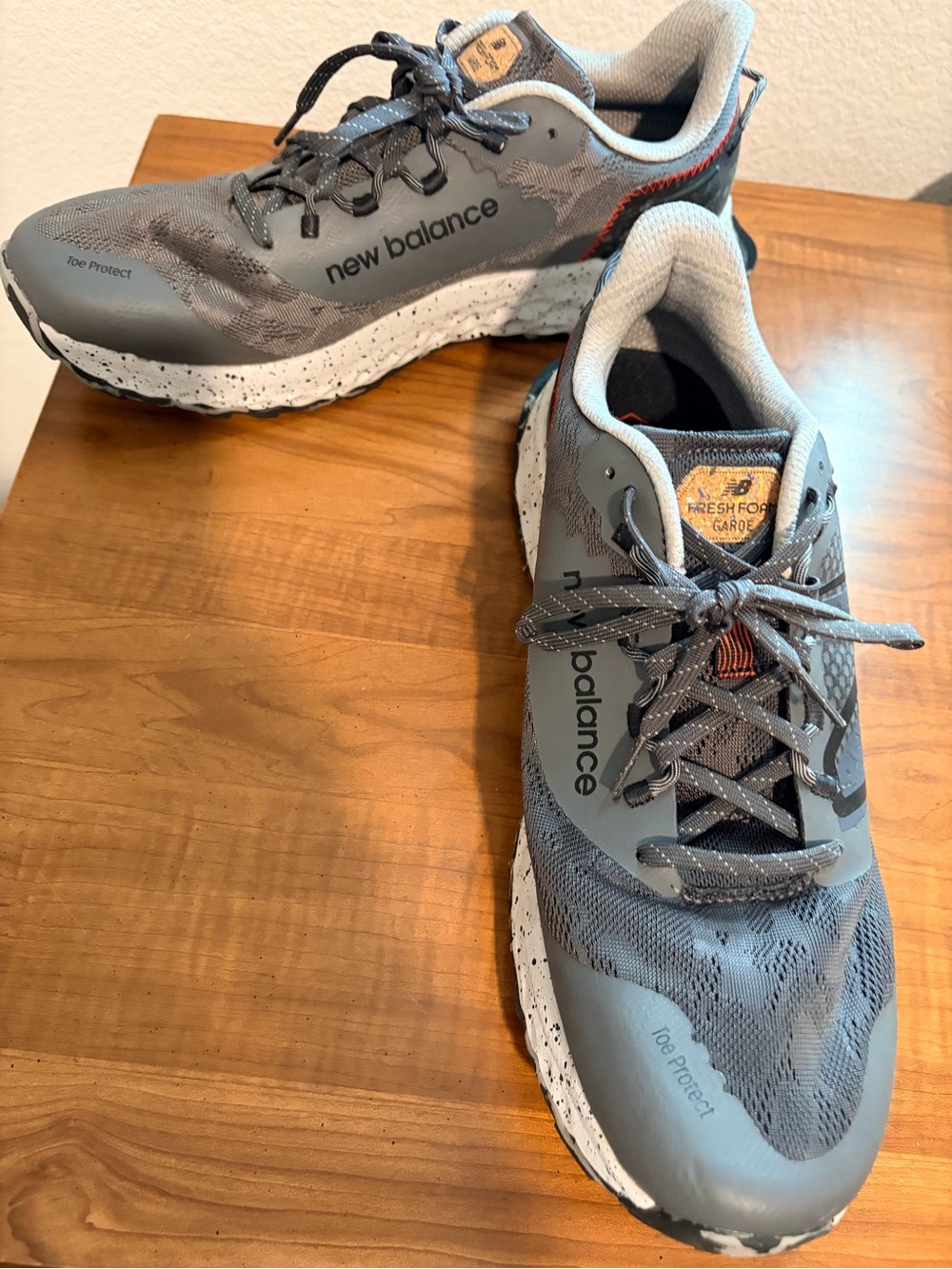 New Balance Men’s Gray Athletic Trail Sneakers with Black and Orange Accents